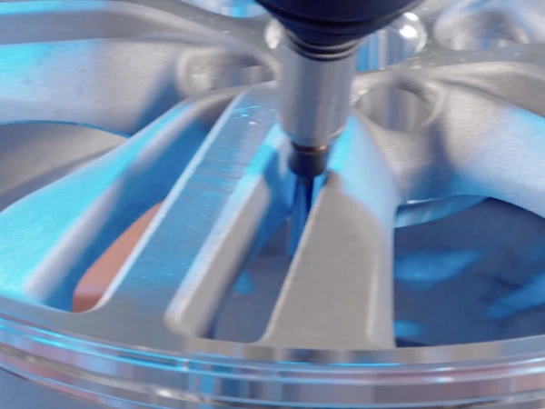 Automotive wheel deburring